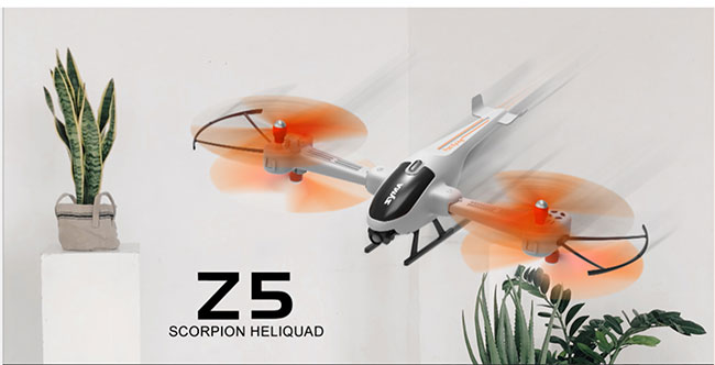 تصویری از کواد کوپتر syma Z5 در حال پرواز با سرعت بالا که نمایی شبیه به هلیکوپتر اما با چهار موتور دارد